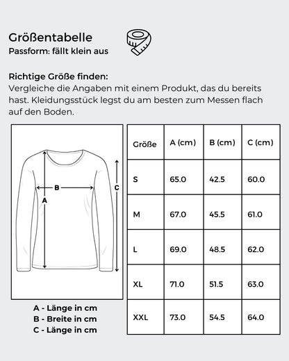 Größentabelle von: Ein schwarzes Langarmshirt mit einem Kunstwerk auf der Vorderseite. Das Motiv zeigt ein stilisiertes Gesicht, halb menschlich, halb futuristisch, mit der gelb-grünen Botschaft „Ich bin so 'PERFEKT' wie ich will“. 