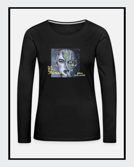 Ein schwarzes Langarmshirt mit einem Kunstwerk auf der Vorderseite. Das Motiv zeigt ein stilisiertes Gesicht, halb menschlich, halb futuristisch, mit der gelb-grünen Botschaft „Ich bin so 'PERFEKT' wie ich will“. 
